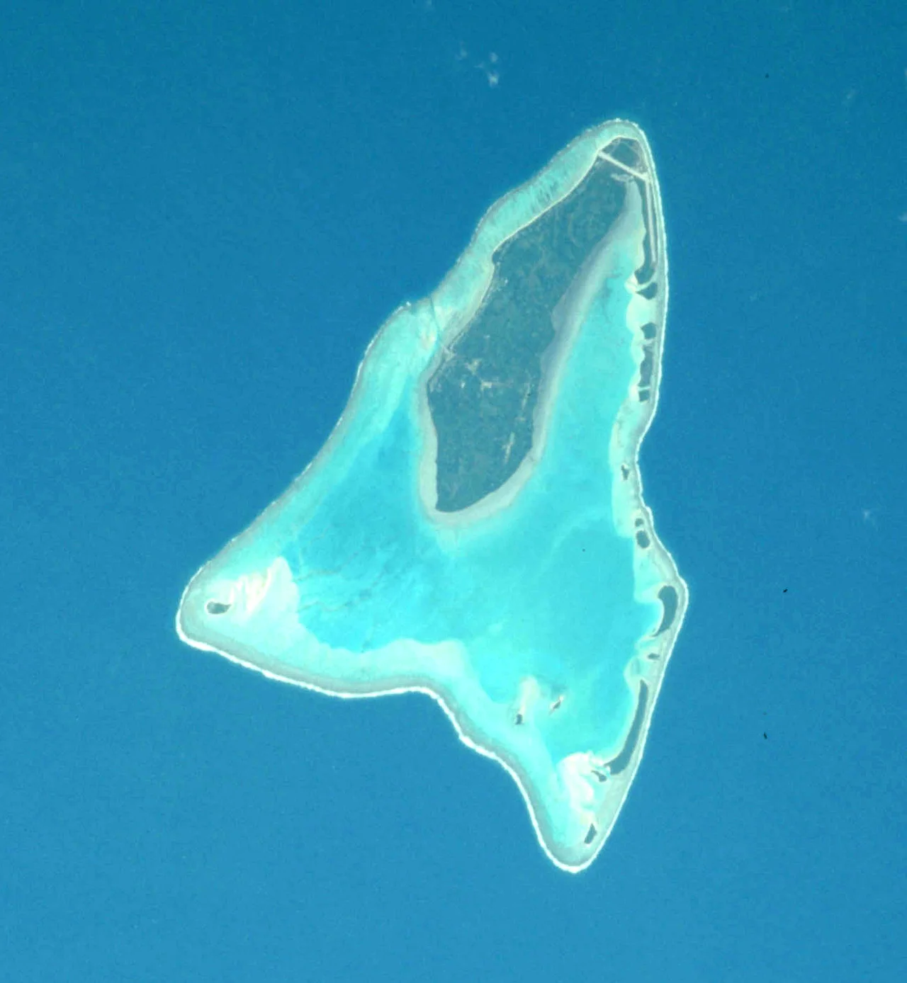 Copped from Apollo-Soyuz Test Project photo AST-01-039 to show Aituctaki Atoll in the Cook Islands. North is up and slightly to the right.