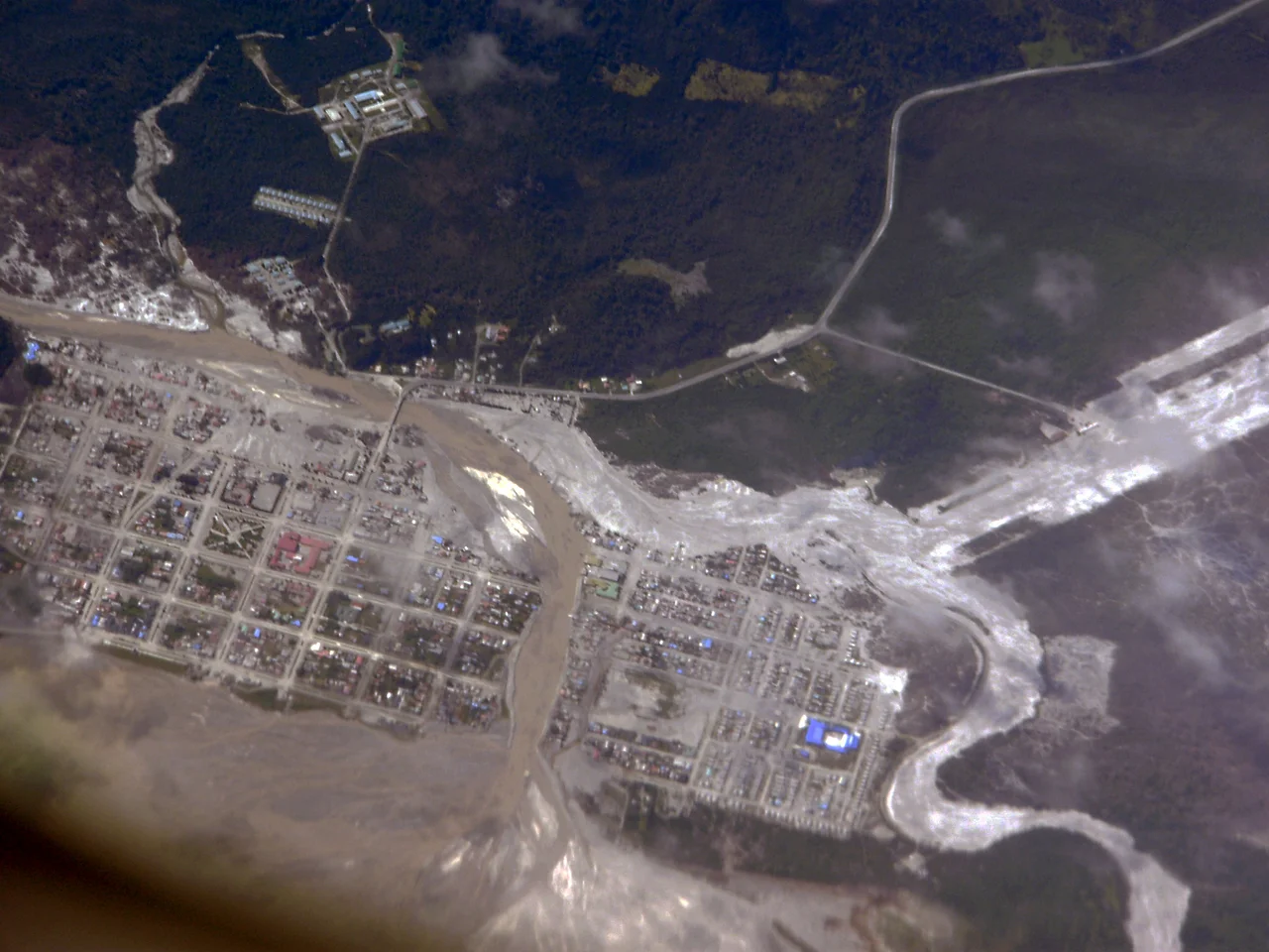 Aerial view of the town of Chaitén, Chile, in February 2009. Two channels of the White River are seen in the image: on the right is the normal course, and on the left is the overflow caused by the eruption of Chaitén volcano.