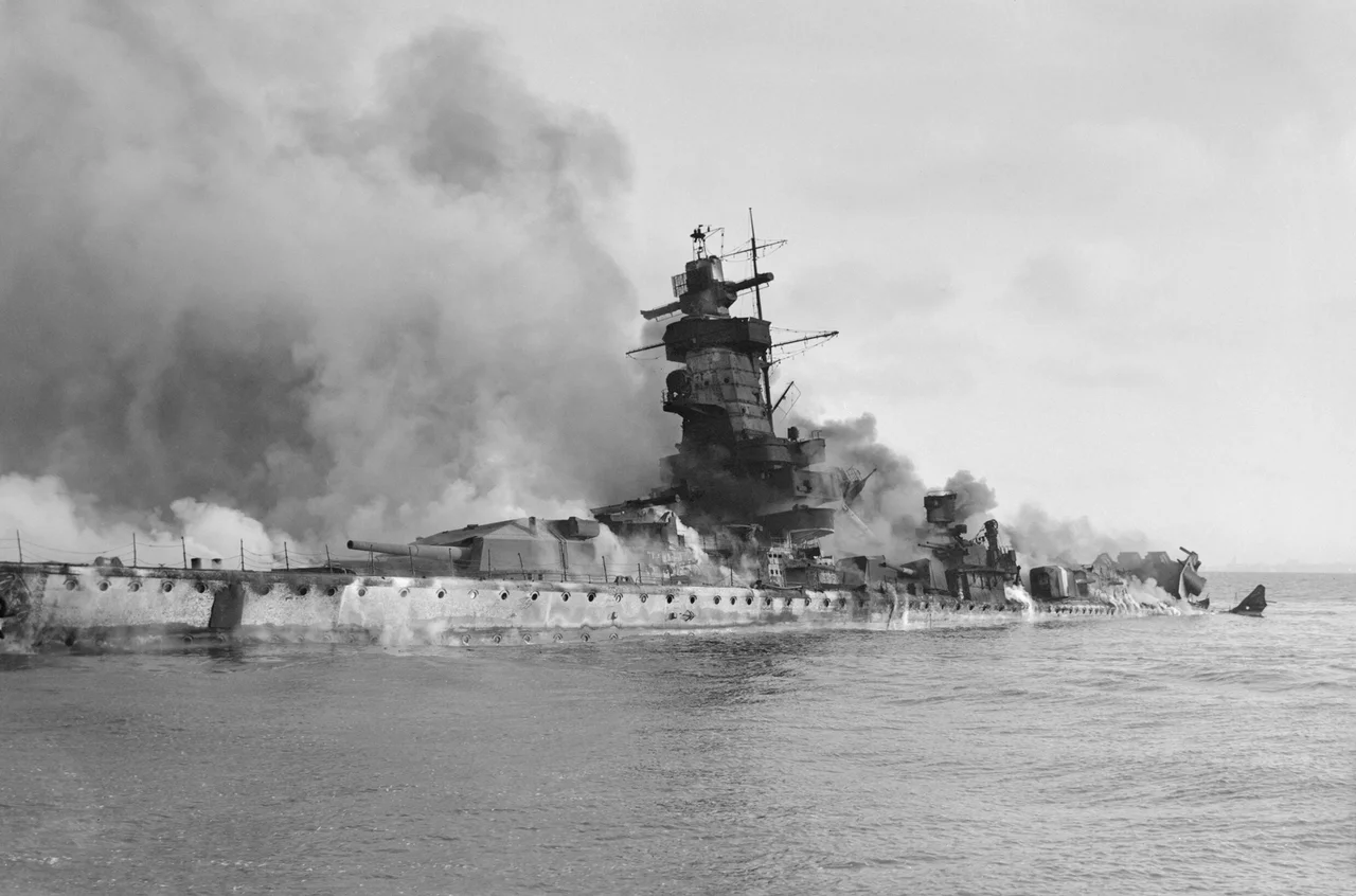 IWM caption : The German battleship Admiral Graf Spee in flames after being scuttled in the River Plate Estuary off Montevideo, Uruguay.