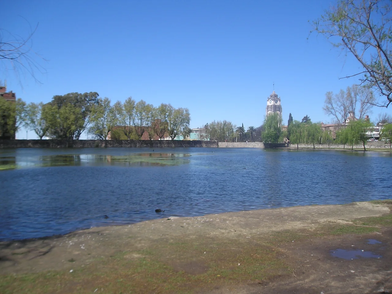 Alta Gracia, Argentina - a tajamar (reservoir) and a clocktower in the background