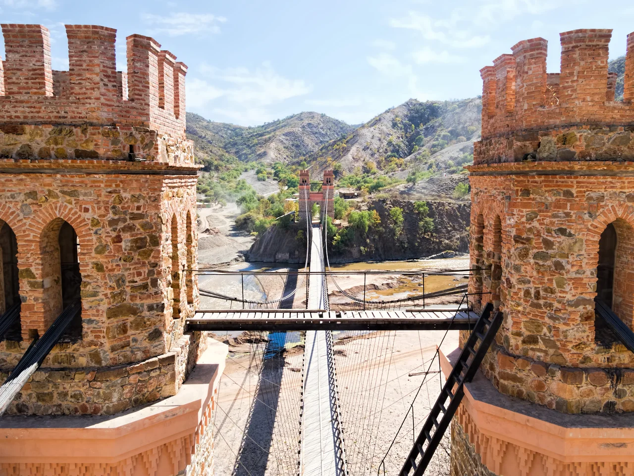 20170807_Bolivia_1322
The Marshal Antonio José de Sucre Suspension Bridge (Puente Colgante “Mariscal Antonio José de Sucre”) is a substantial pedestrians-only suspension bridge over the Pilcomayo River that we spot along Route 5 on our drive from Sucre to Potosí.  Built at the end of the 19th century, the bridge was most recently repaired in 2008.  The far side of the river (as the far tower indicates) is Chuquisaca Department while the near side is Potosí Department.
The bridge is named after Antonio José de Sucre who led as Grand Marshal in the decisive battle of Ayacucho in 1824 that consolidated the independence of Peru and Upper Peru (Alto Perú) which later became Bolivia.  He was a close friend of Simón Bolívar and served as the second president of Bolivia from the end of 1825 to 1828.
On Google Earth:

Marshal Antonio José de Sucre Suspension Bridge  19°21'19.04"S, 65°10'38.88"W