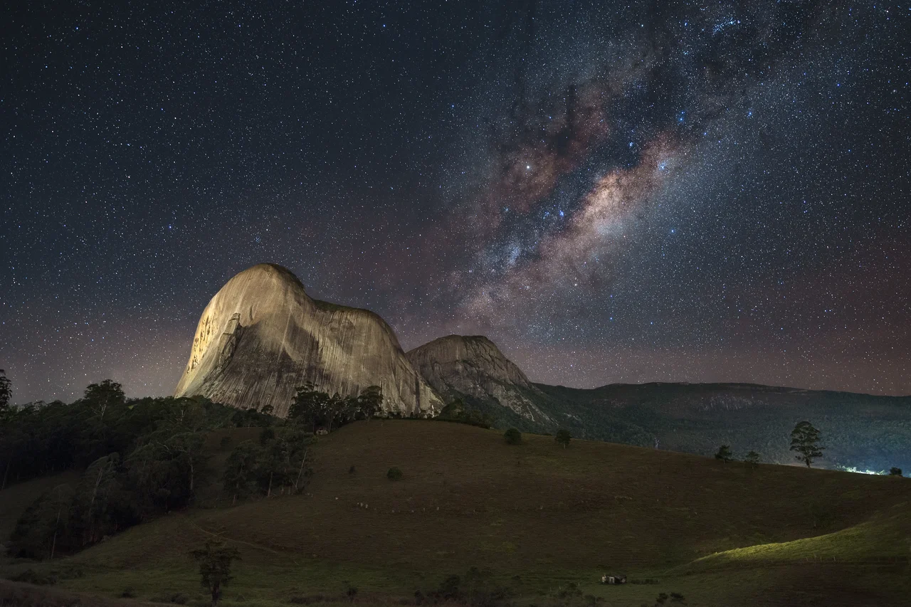 Pedra Azul (Blue Stone) peak with the center of the Milky Way above it. Pedra Azul State Park is a state park in Domingos Martins, Espírito Santo, Brazil.