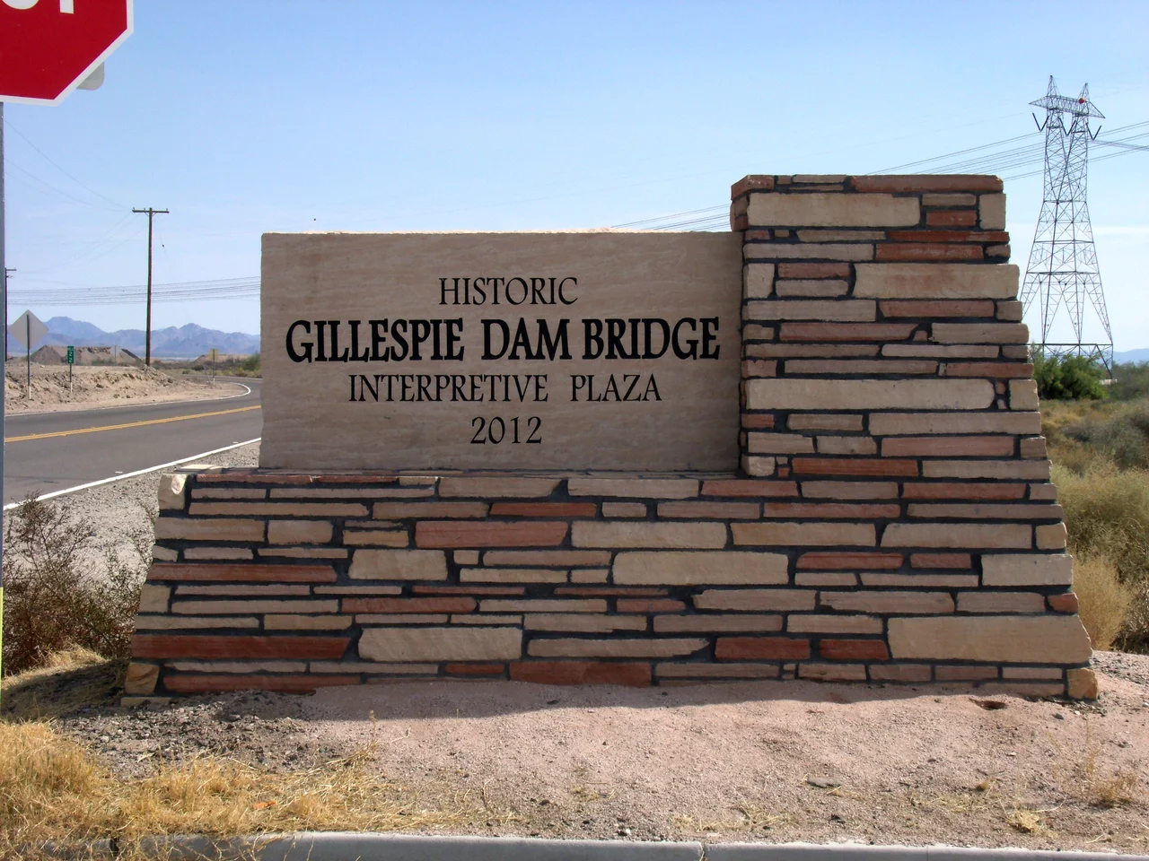 The historic Gillespie Dam Bridge marker. The historic Gillespie Dam Bridge was built in 1927 over the Gila River and is located on Old Highway 80 north of Gila Bend and south of Arlington between the Buckeye Hills and the Gila Bend Mountains in Maricopa County. The bridge was at the time the longest highway bridge in the state of Arizona. The bridge was listed on the National Register of Historic Places on May 5, 1981, reference #81000136