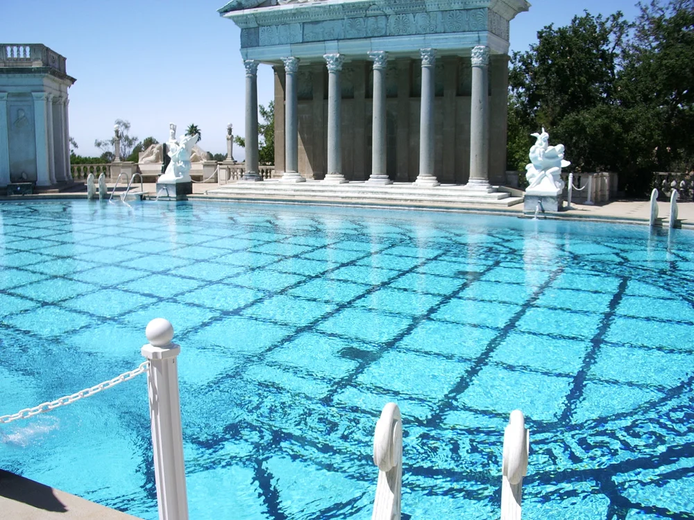 One of the centerpieces of the private residence of William Randolph Hearst, is this outdoors swimming pool. It is decorated with the facade of a Roman temple as well as sculptures made of marble from the Dolomites in Italy. (Italy now bans export of Dolomite marble.)
In the present day, California runs Hearst Castle as a state park, offering several guided tours. The Neptune Pool serves as the starting point for all guided tours.
I am making Hearst Castle a stop during a drive up the Central California coast on my way to the San Francisco Bay Area.