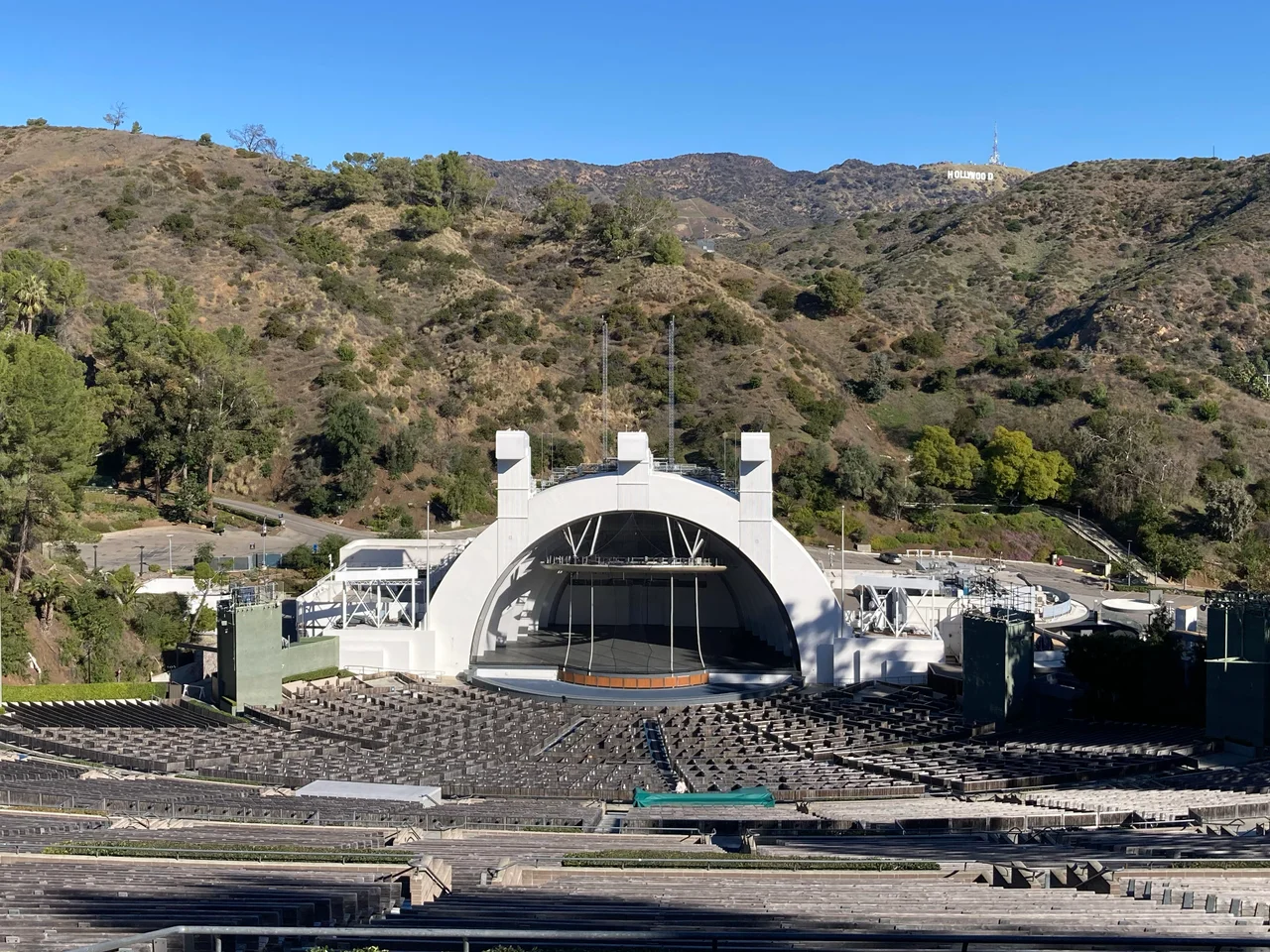 The Hollywood Bowl amphitheatre, stage and Hollywood sign in mountains behind