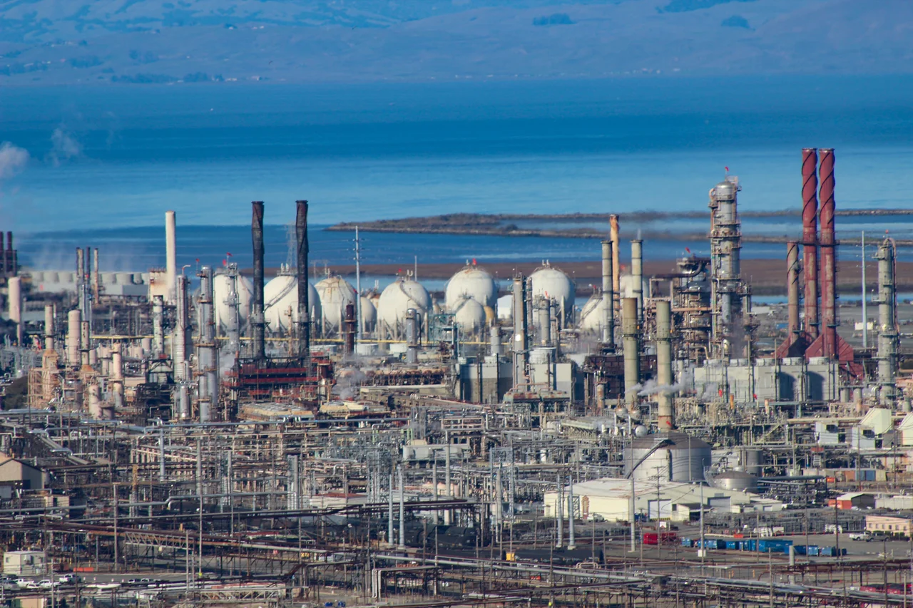 Detail of Chevron Richmond Refinery with backdrop of San Pablo Bay, taken from Nicholl Knob in of  Miller/Knox Regional Shoreline Park