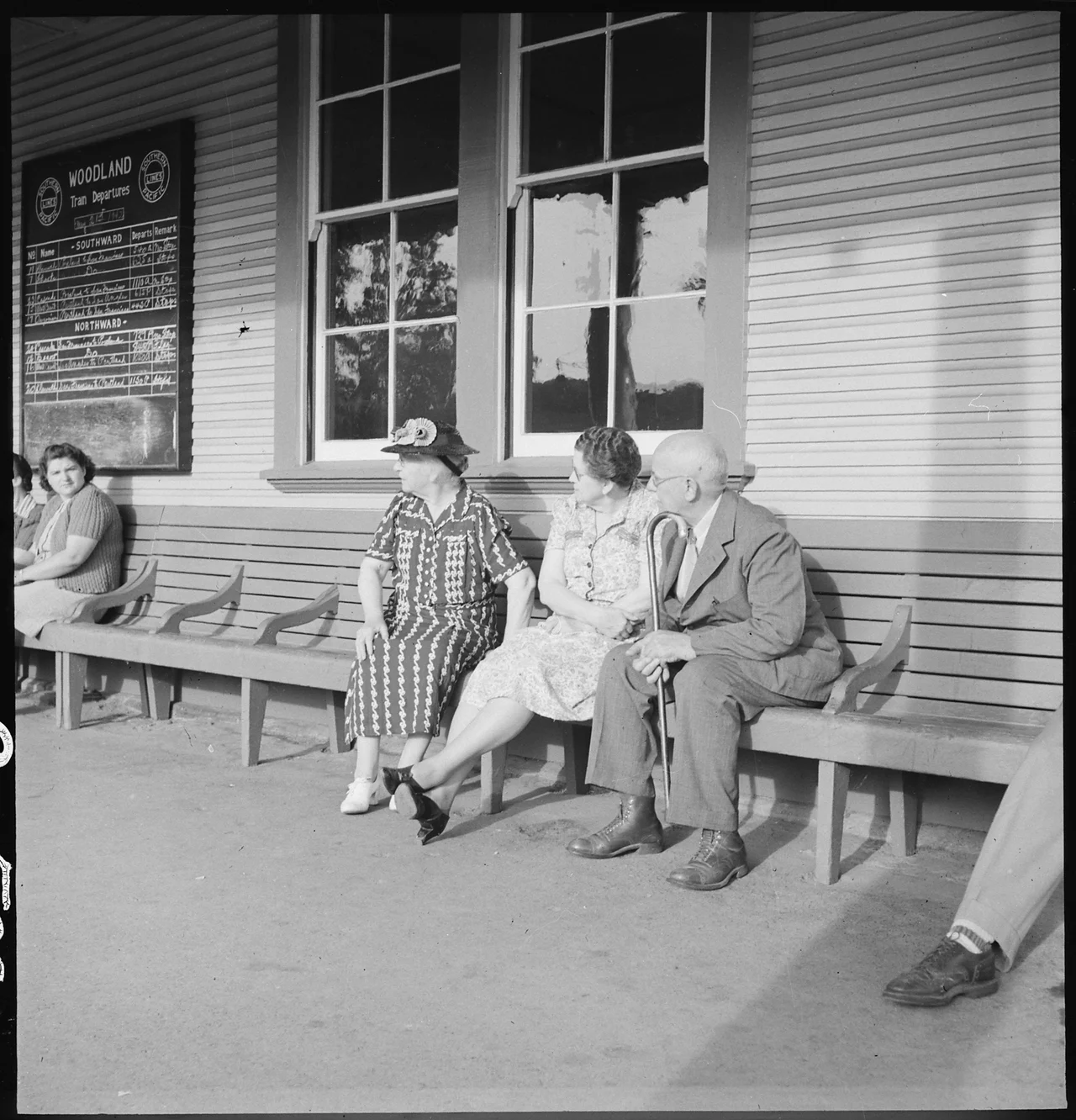 Scope and content: The full caption for this photograph reads: Woodland, California. The departure of persons of Japanese ancestry by special train for Merced Assembly center brought many of their Caucasian friends to the station on this morning when they were being evacuated. Woodland is situated in the rich agricultural Sacramento Valley about ten miles northwest of Sacramento, California.