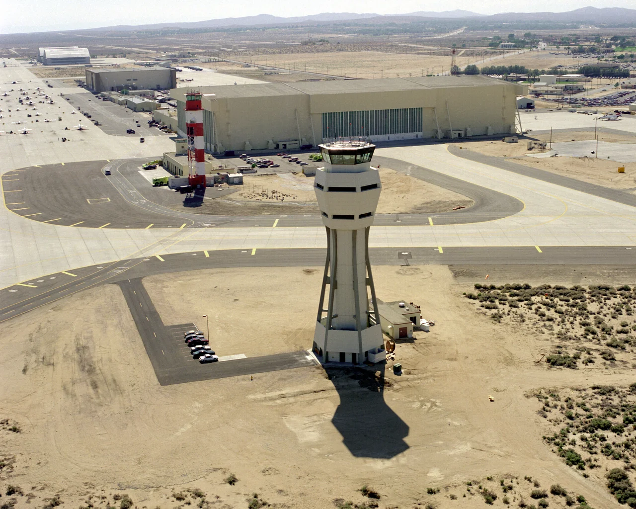 An aerial view of the new control tower, with the old tower in the background. Location: Edwards Air Force Base, California (CA), United States of America (USA).