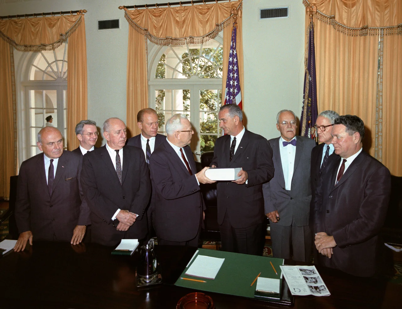 Members of the Warren Commission officially present their report on the assassination of President John F. Kennedy to President Lyndon Johnson. Cabinet Room, White House, Washington DC.

L-R: John McCloy, J. Lee Rankin (General Counsel), Senator Richard Russell, Congressman Gerald Ford, Chief Justice Earl Warren, President Lyndon B. Johnson, Allen Dulles, Senator John Sherman Cooper, and Congressman Hale Boggs