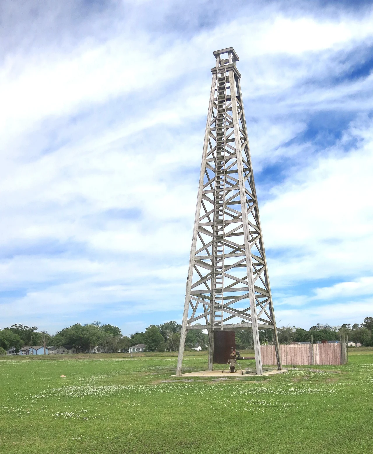 Discovery well of the Spindletop Oil Field changed Texas. It was the first important well on the Gulf Coast. It blew in on Jan. 10, 1901, flowing 100,000 barrels of oil a day from a depth of 1020 feet. The oil production which resulted made Beaumont a city and Texas the major oil refining and exporting center of the world, which it still is today. The Lucas Gusher was drilled by the Hamill Brothers, contractors, under the direct supervision of Captain Anthony F. Lucas for Guffey and Galey of Pittsburgh, on the McFaddin, Weiss and Kyle lease.
This replica of Lucas' famous Spindletop gusher is not located at Spindletop Park, rather it is at Gladys City 1.5 miles away.  There is a museum, monument and somehow got the historical marker moved to this place.  I don't know the schedule but periodically they shoot a stream of water up and out the top to simulate a gusher.