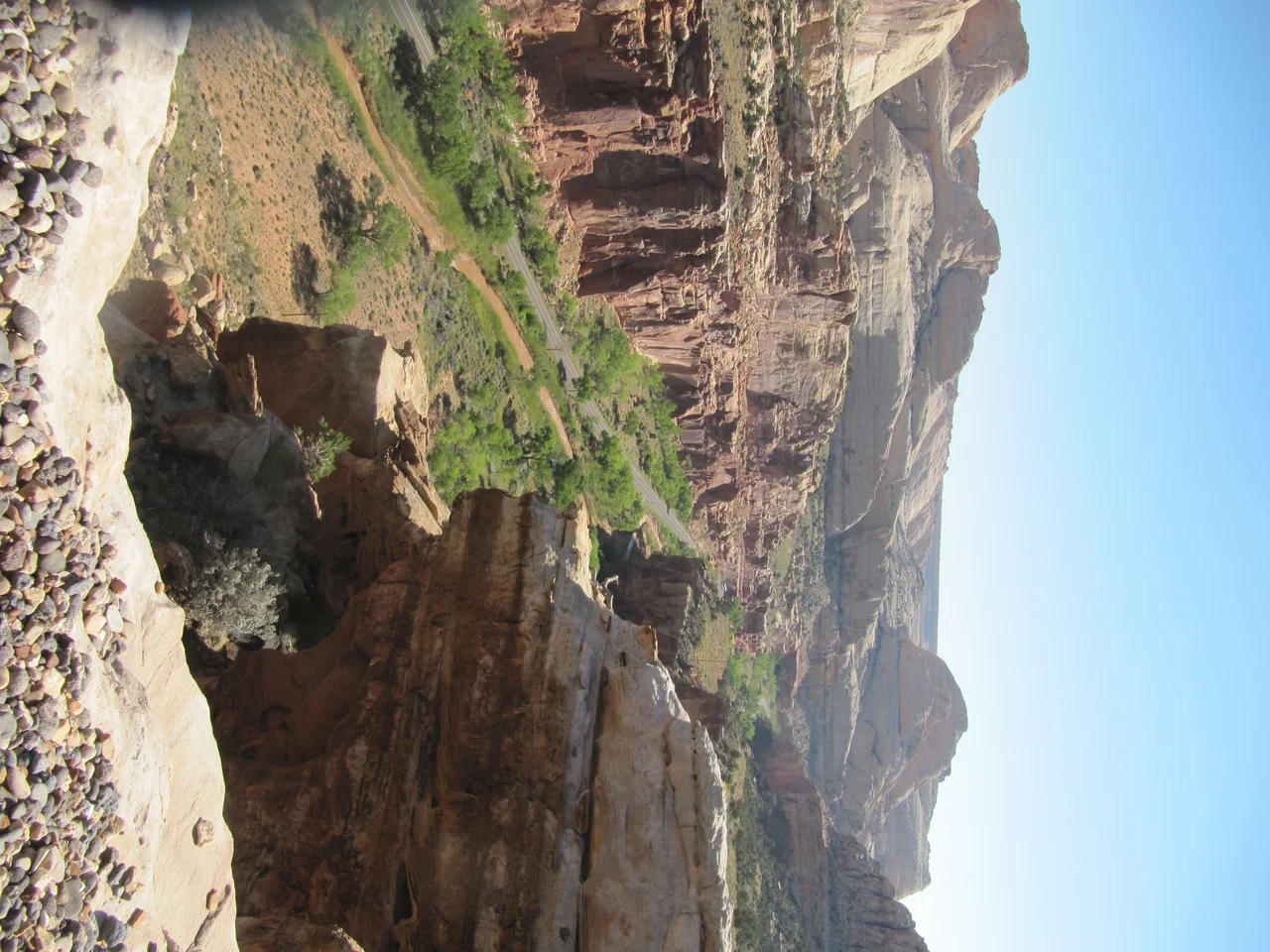 View of a peach and apple orchard and Highway 24 from the top of the North Overlook on Cohab Canyon Trail, Capitol Reef National Park.