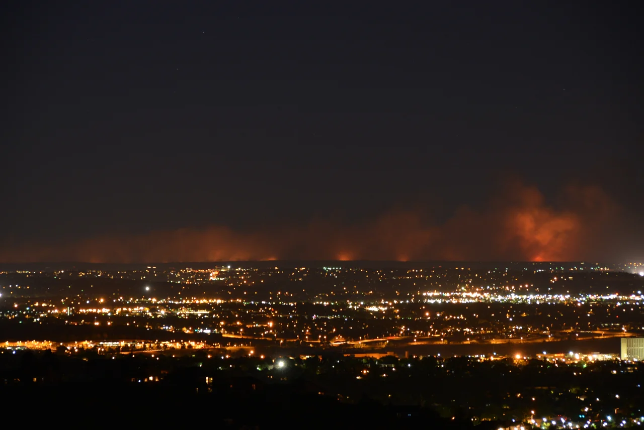 A night time image of the Black Forest Fire at 9:30 pm on the night of the first day, 11 June 2013.  Photo was taken from the Broadmoor Bluffs neighborhood of Colorado Springs on the lower slope of Cheyenne Mountain, about 20 miles away.