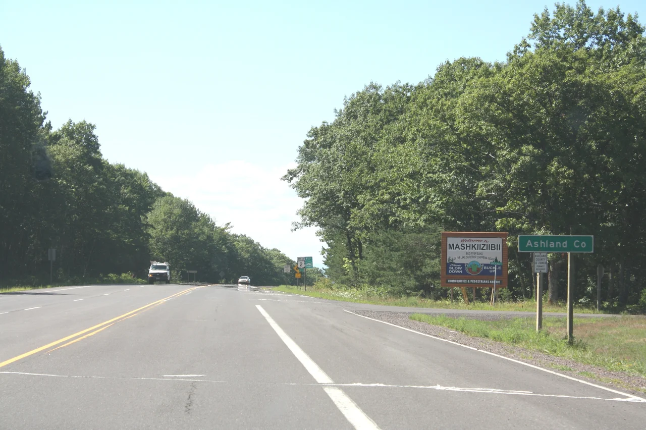 The sign for w:Ashland County, Wisconsin on U.S. Route 2. It also marks the Bad River Indian Reservation and the sign for the Lake Superior Circle Tour is visible farther in the background. This file was uploaded with Commonist.