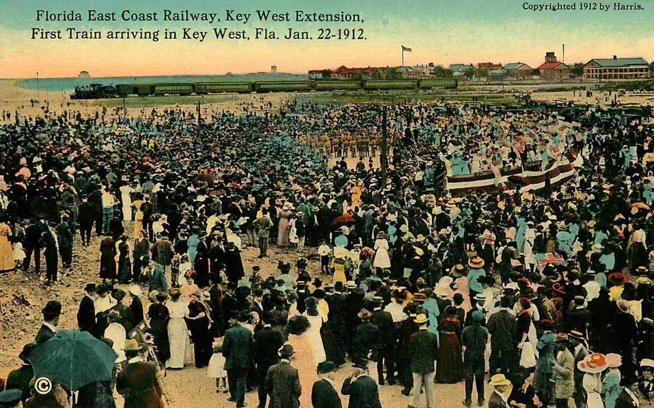 Color tinted postcard photo of the Florida East Coast Railway's first train arriving at Key West, Florida, on 22 January 1912. The first train carried the railroad's president and financier, Henry M. Flagler, in his private car.