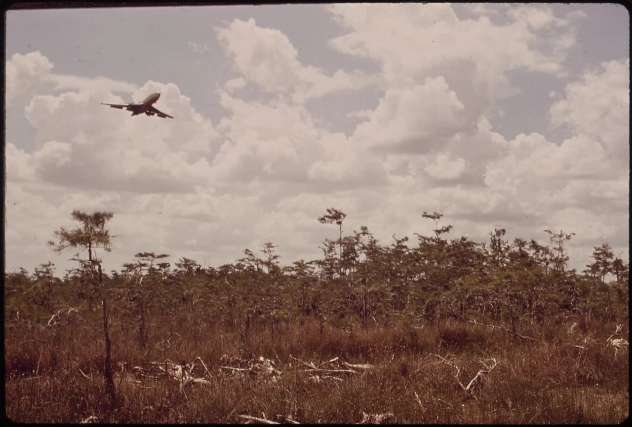 JET LANDING AT THE CONTROVERSIAL MIAMI-DADE JET PARK - NARA - 544606.jpg