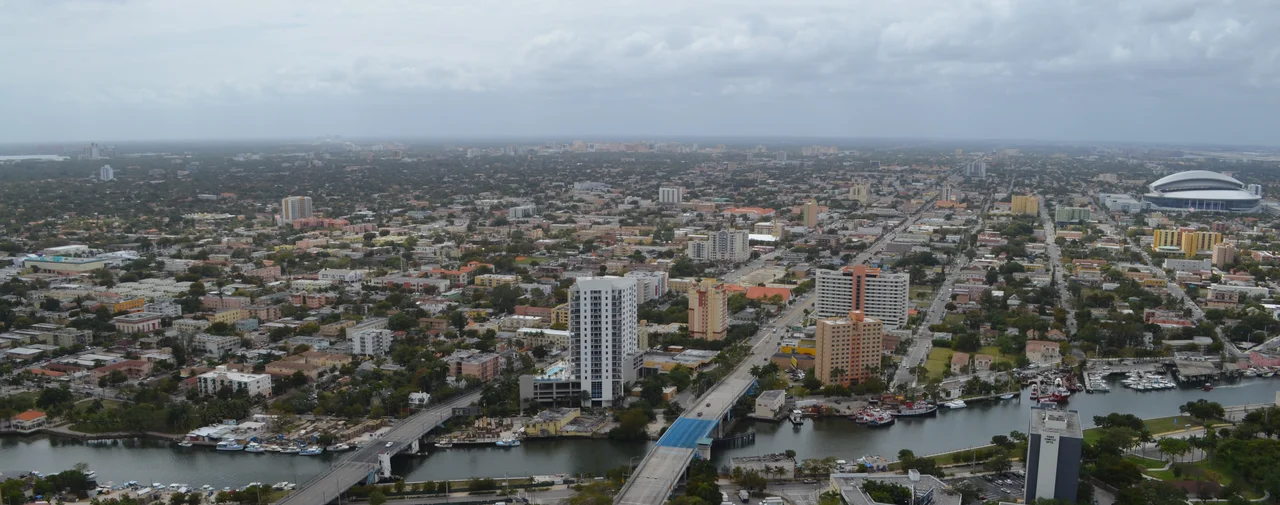 Aerial view of en:Little Havana en:Neighborhoods of Miami. At right is en:Marlins Park, in the background en:Coral Gables skyline can be seen, to the very left is en:Coconut Grove.