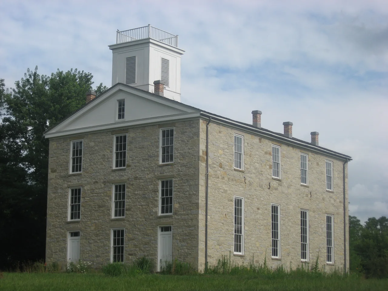 Front and western side of the surviving main building from Eleutherian College, located at 6927 State Road 250 at Lancaster in Lancaster Township, Jefferson County, Indiana, United States. Built in 1856, the building was used as a public school and community center after the college's closure in the 1880s. Now a museum, it has been declared a National Historic Landmark.