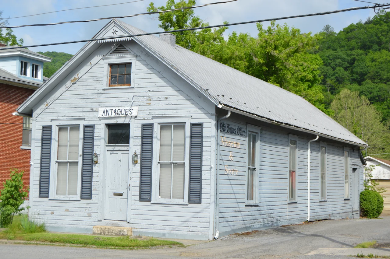 Front and northeastern side of the former print shop for the Pocahontas Times (now an antiques shop and museum), located at 810 Second Avenue in Marlinton, West Virginia, United States.  Built in 1900, it is listed on the National Register of Historic Places.