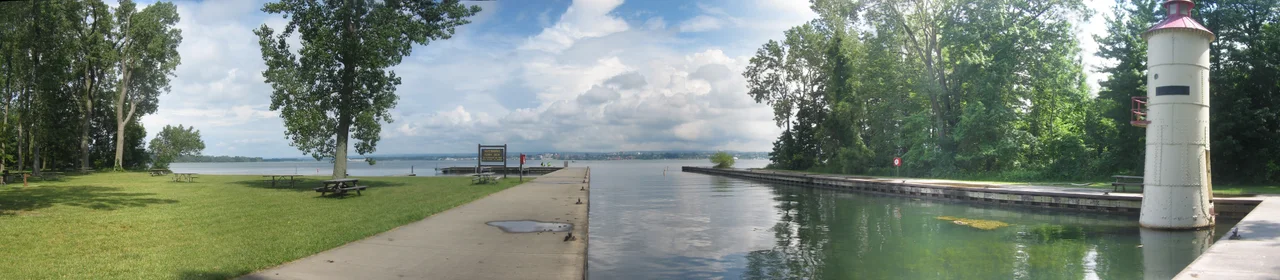 Waterworks Ferry lighthouse and dock with Presque Isle Bay and the city of Erie in the background from Presque Isle State Park in Erie County, Pennsylvania, United States