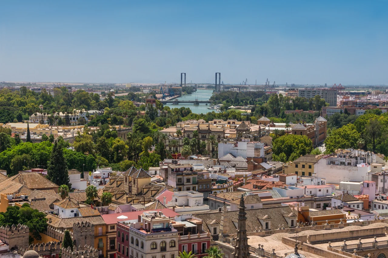 Roofs, Guadalquivir river, Delicias Bridge, 5th Centenary Bridge, from the top of the Giralda, Seville, Spain.