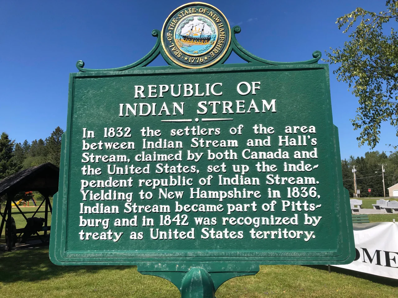 New Hampshire historical marker number one in Pittsburg, New Hampshire, commemorating the Republic of Indian Stream. Marker is located at the town park along U.S. Route 3.