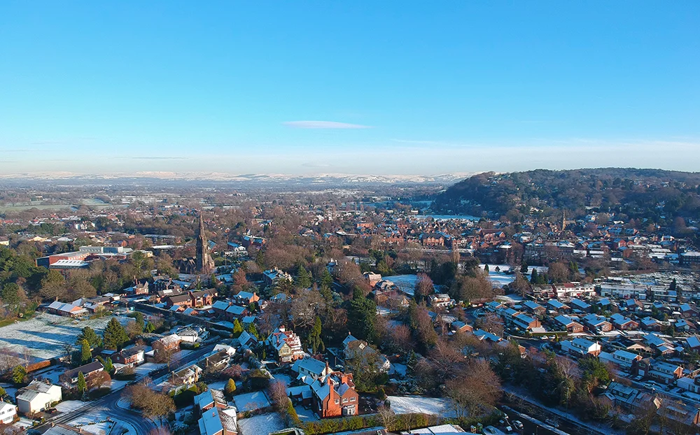 Aerial photograph of Alderley Edge taken in December 2017, showing St. Philips Church (centre left) and the Edge sandstone escarpment (right).