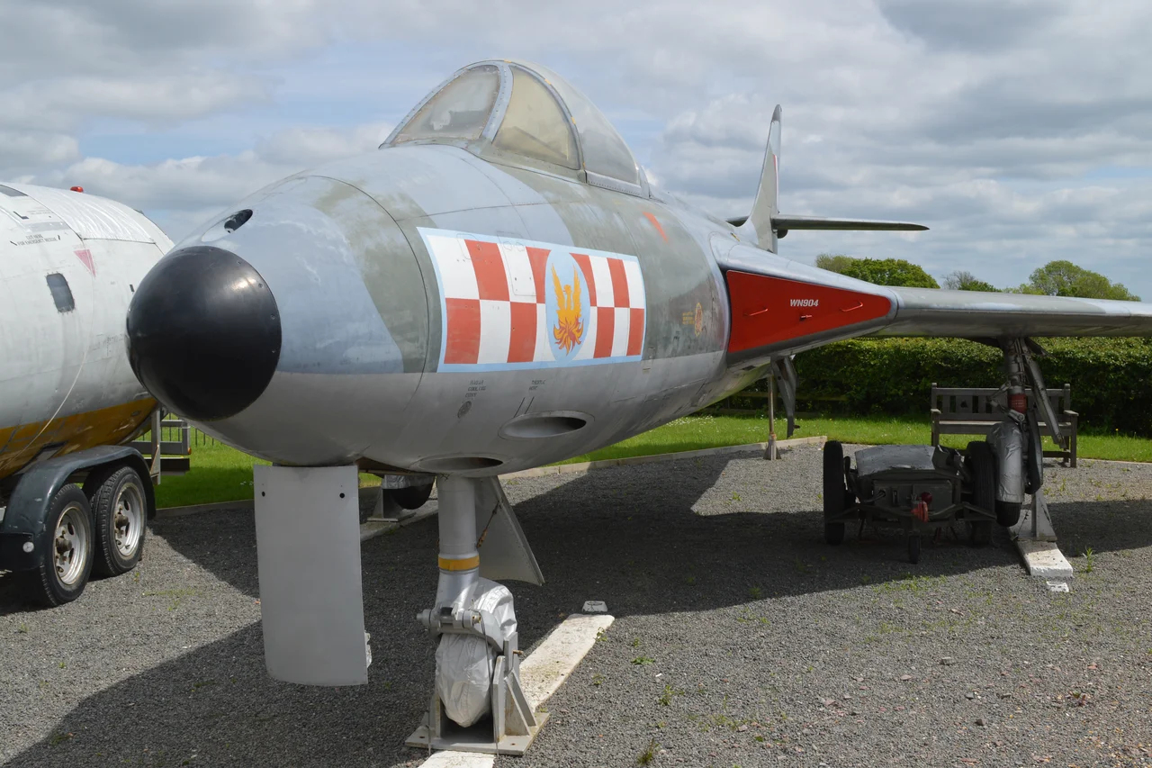 c/n S4/U/2912.
Built 1954.
British military serial WN904.
Among the 1,972 Hunters built, the F.2 was a rare mark. It was powered, along with the F.5, by the 8,300lbf Armstrong Siddeley Sapphire 101, instead of the Rolls-Royce Avon used in all other marks of Hunter. 
Built by Armstrong Whitworth at Coventry, only 45 were produced and this is now the only surviving example.
Delivered to 257sqn at Wattisham in September 1954, she remained with the unit until severely damaged in January 1956. Although repaired, she was then stored until 1958 when she went to the Melksham School of Technical Training as ‘7544M’.
In 1974 she was donated to the Imperial War Museum collection at Duxford, but was later loaned out to serve as a gate guard at Waterbeach Barracks, the former RAF Waterbeach. 
She is now painted in 56sqn markings and is on permanent display at the Sywell Aviation Museum.
Sywell Aerodrome, Northamptonshire, UK.

21st May 2017