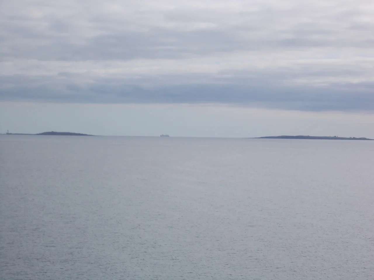 A view of Copeland Islands in the middle in back ground an Stena Line ferry going to England and the photo was taken on a Stena Line ferry heading to Scotland