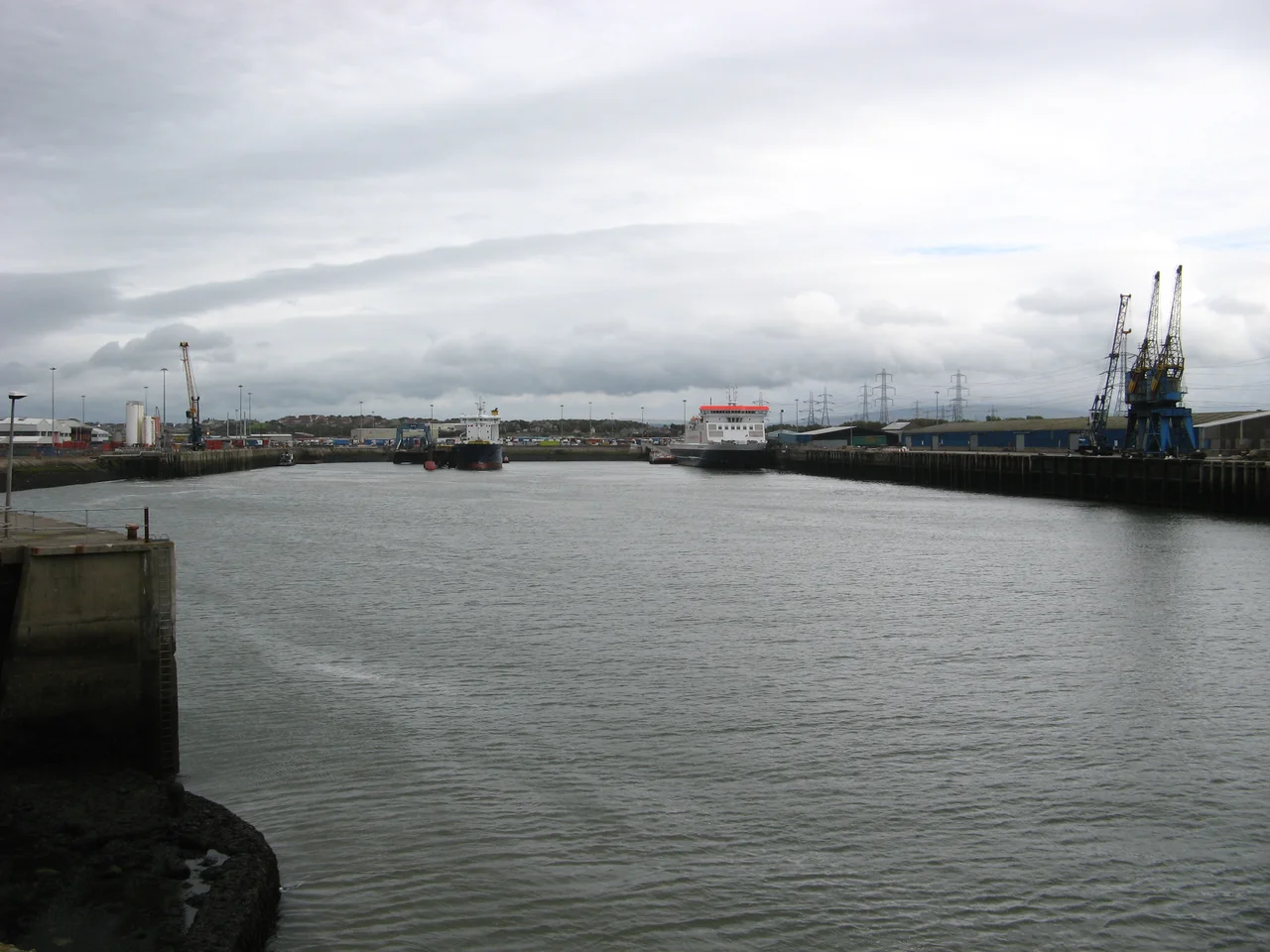 Heysham Harbour, from harbour entrance; Lancashire, England. Isle of Man Steam Packet Company ferry Ben-my-Chree is on the right at the South Quay. To the left the North Wharf is in the distance, and a corner of the Fish Quay can be seen closeby.