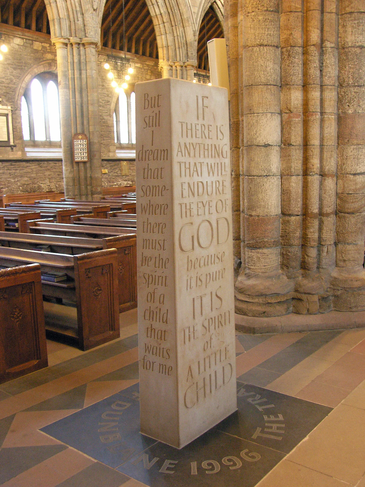 The Standing Stone sculpted by Richard Kindersley to commemorate the events in Dunblane of 13th March 1996 - the Dunblane school massacre. Text on left is from The poet's journal by Bayard Taylor (page 80, published by Ticknor and Fields in 1863); text on right is from The Children's Prayer by Richard Henry Stoddard (born 1825, died 1903).