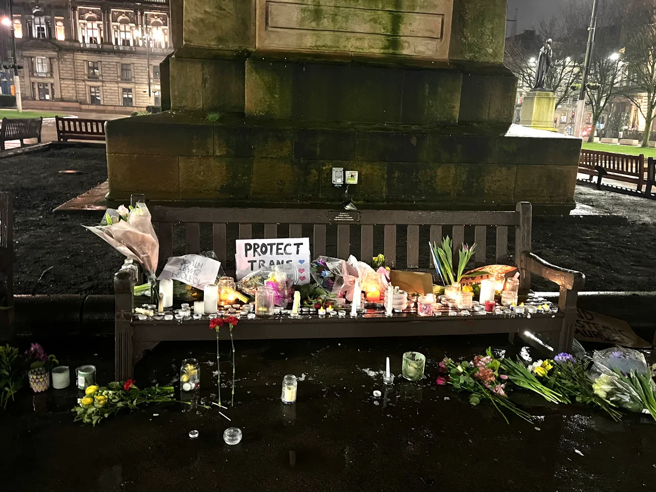 After Brianna Ghey, a 16 year old trans girl, was stabbed to death, there were protests and candlelight vigils across the UK. This photo is of one of three benches full of candles, cards, flowers and placards after the vigil in George Square, Scotland.