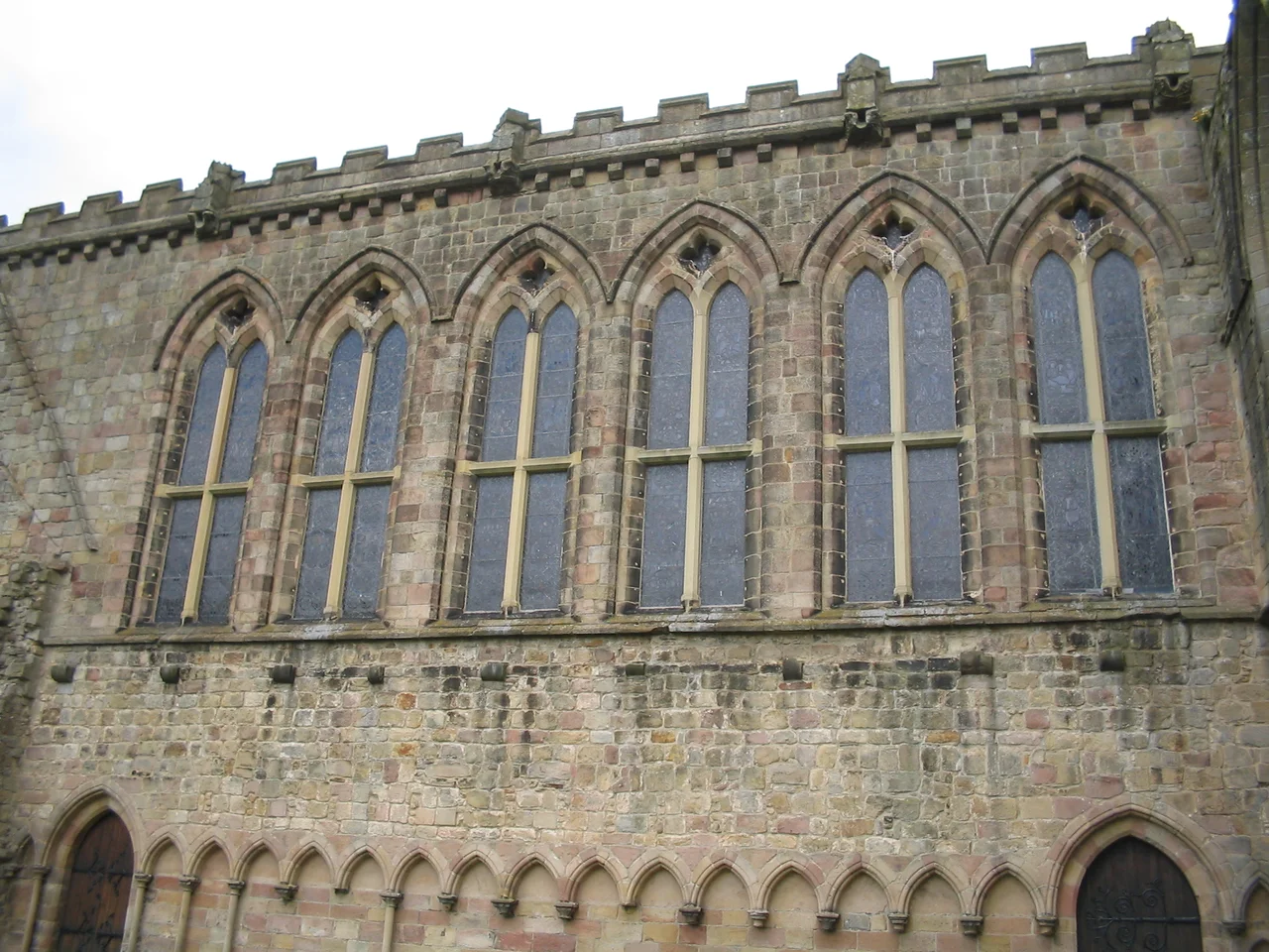 The stained glass windows of the Priory Church at Bolton Abbey.  The church entrance is around the corner to the left; the abbey ruins are to the right.

David Benbennick took this photo on Tuesday, May 10 at 1:53 PM (12:53 UTC).