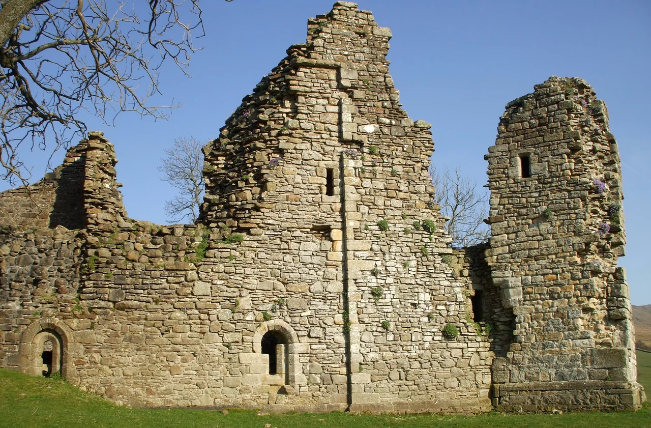 West wall of Pendragon Castle Built as a Late Norman pele tower. It was burnt by the Scots in 1541, but was restored by Lady Anne Clifford in 1660; however by the mid 18thC it had become a ruin again.