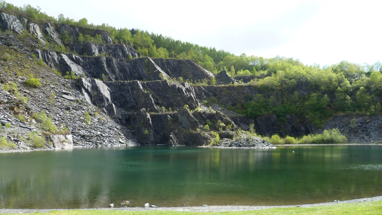 The quarry opened two years after the infamous 'Glencoe Massacre' of 1692. It expanded rapidly in the 19th century, supplying most of the roof slates for Scotland's growing industrial towns. In 1845 some 26 million slates were produced. The Glasgow architect Charles Rennie Mackintosh used Ballachulish slate in many of his buildings.