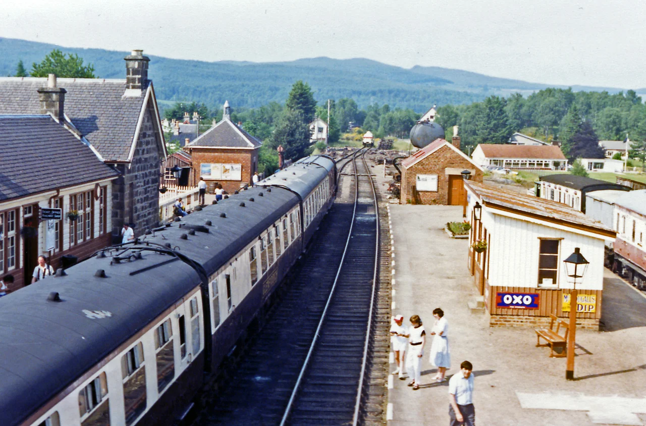 Boat of Garten station, Strathspey Railway, 1986.
View northward, towards Broomhill, latterly to Forres, also Grantown and Craigellachie: Strathspey Heritage Railway - formerly Highland and Great North of Scotland Railway -- for details see NH9418 : Boat of Garten Station. On the left is a train from Aviemore; for a view the other way, see NH9418 : Boat of Garten station, Strathspey Railway, 1986.