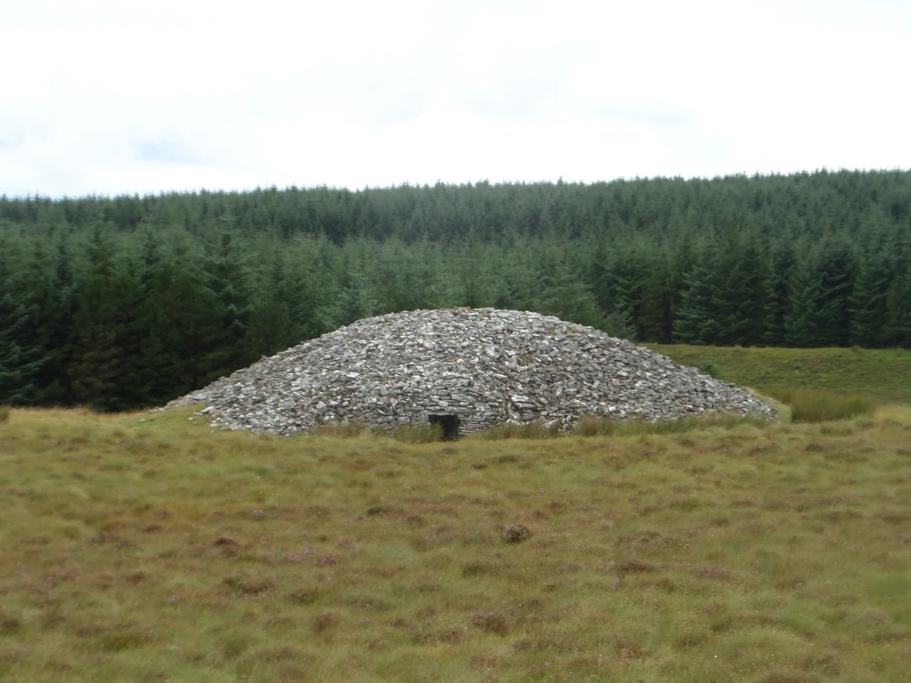 The Grey Cairns of Camster are two large Neolithic chambered cairns in the Highland region of Scotland. They date to about 5,000 years ago. The cairns demonstrate the complexity of Neolithic architecture, with central burial chambers accessed through narrow passages from the outside.