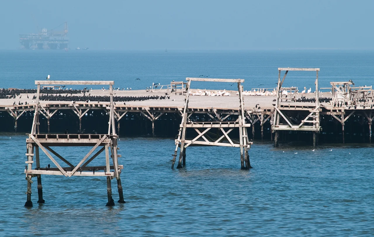 Close view of Bird Island from Namibian coast near Walvis Bay