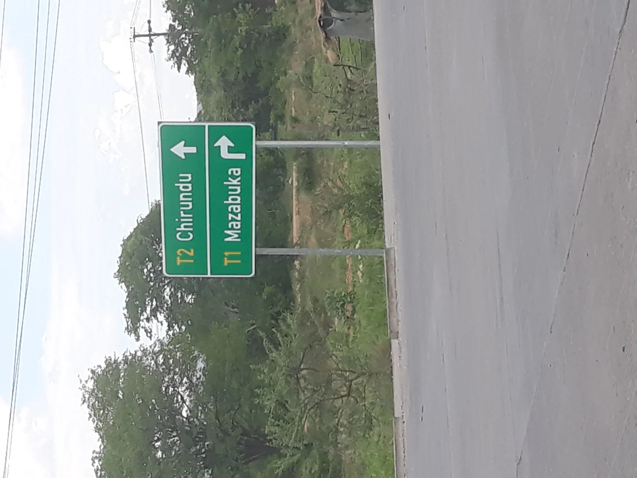 A road sign at the T2 &amp; T1 junction in Chikankata District, Southern Province, Zambia