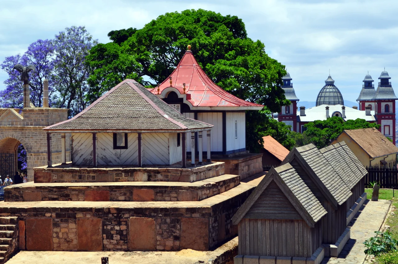 Left to right: Main gate with voromahery (eagle) sculpture, royal tombs of Radama I & Rasoherina, and the Fitomiandalana (seven aligned tombs) at the Rova of Antananarivo, Madagascar.