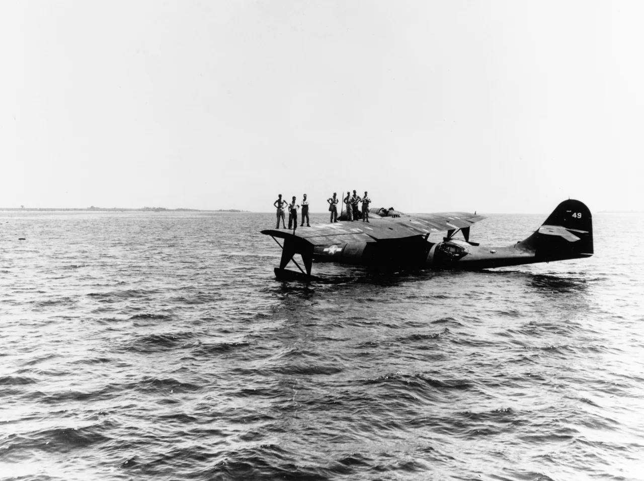 U.S. Navy Consolidated PBY-5 or PBY-5A Catalina waits off the Morotai shore to pick up press copy giving accounts of the landings there, 15 September 1944.