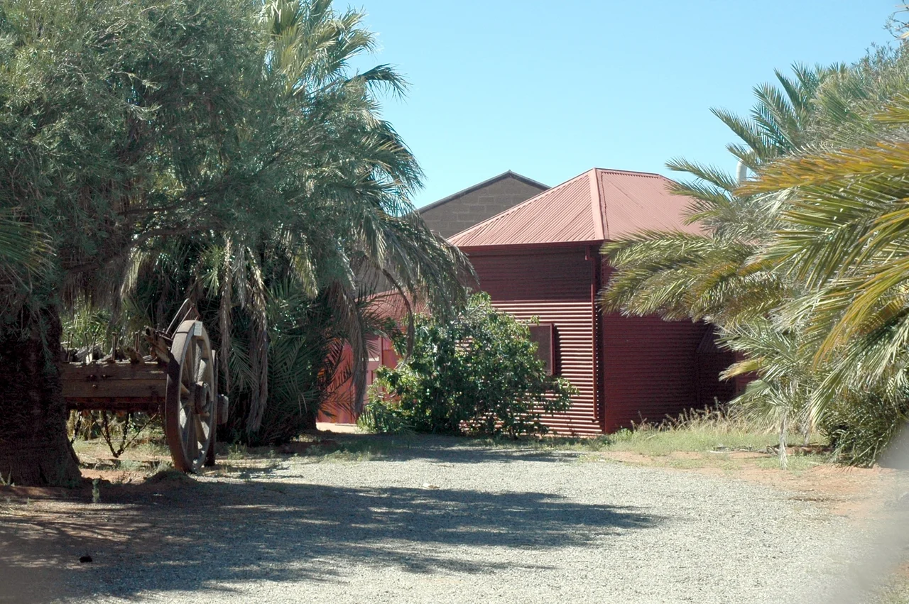 Historic mosque in the mining city of Broken Hill, New South Wales, Australia (about 1100km west of Sydney), In the 19th and early 20th centuries camels were used extensively in outback Australia, and many of the camel keepers were Afghans. The camels and their keepers are gone, but this humble mosque remains as a reminder of the important part they played in the development of modern Australia. Another early Afghan-Australian mosque survives in the town of Bourke.
Note the camel cart and the date palms.
