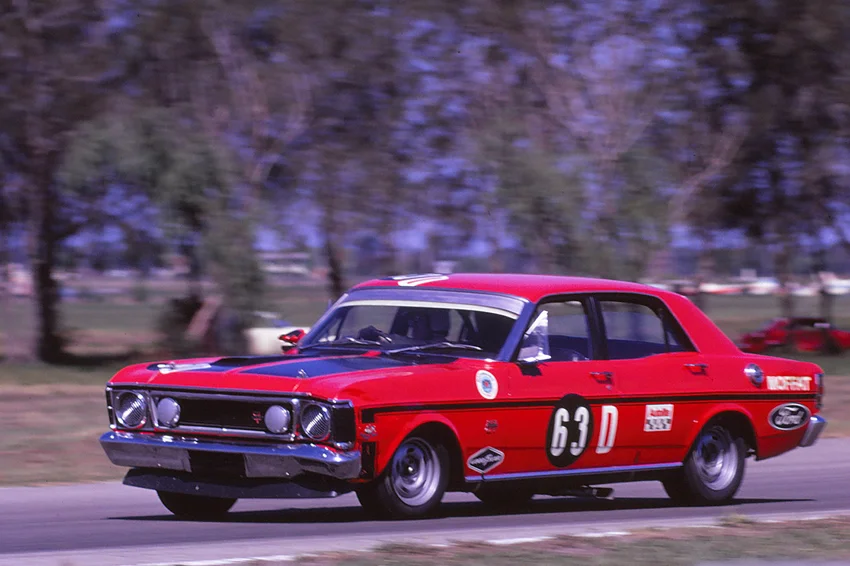 Allan Moffat in the works Ford XW Falcon GTHO at Surfers Paradise International Raceway, 1 November 1970. Moffat won the 1970 Rothmans 250 Production Classic on that day.Surfers Paradise International Raceway was located in Carrara, Gold Coast, Queensland, Australia.