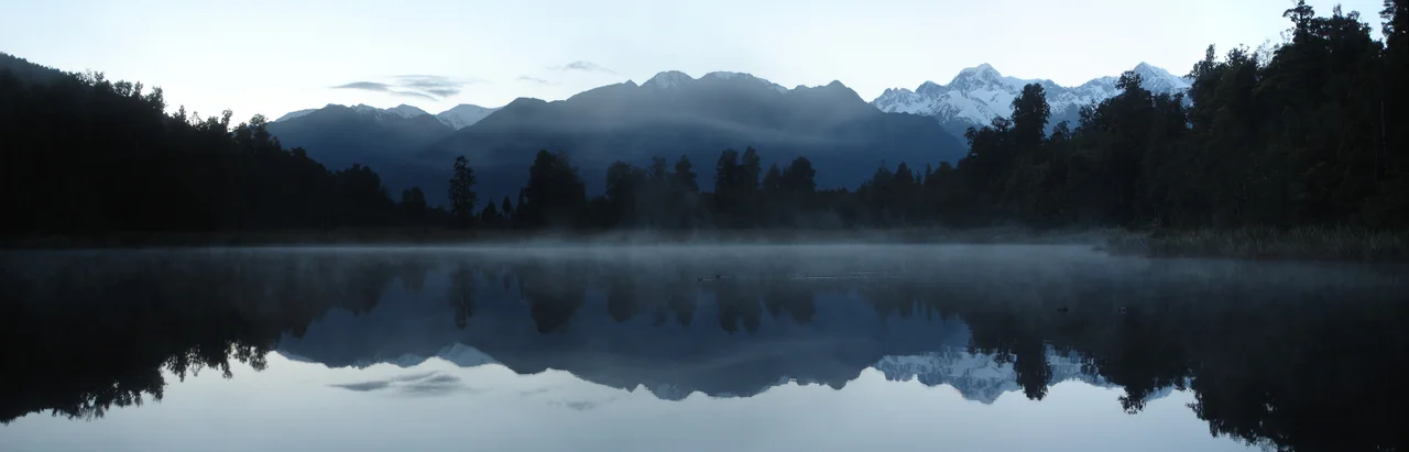 Mount Cook is reflecting in Lake Matheson in the early morning shortly before sunrise (6:31 am), near the Town of Fox Glacier, New Zealand. Watch out for the Ducks!