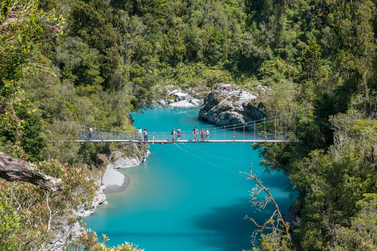 Hokitika Gorge in the Hokitika Scenic Reserve, West Coast, New Zealand. The reserve is 33 km east of Hokitika, and contains walking tracks in mature rimu, miro, and kamahi forest, with viewing platforms and a swingbridge across the Hokitika River.