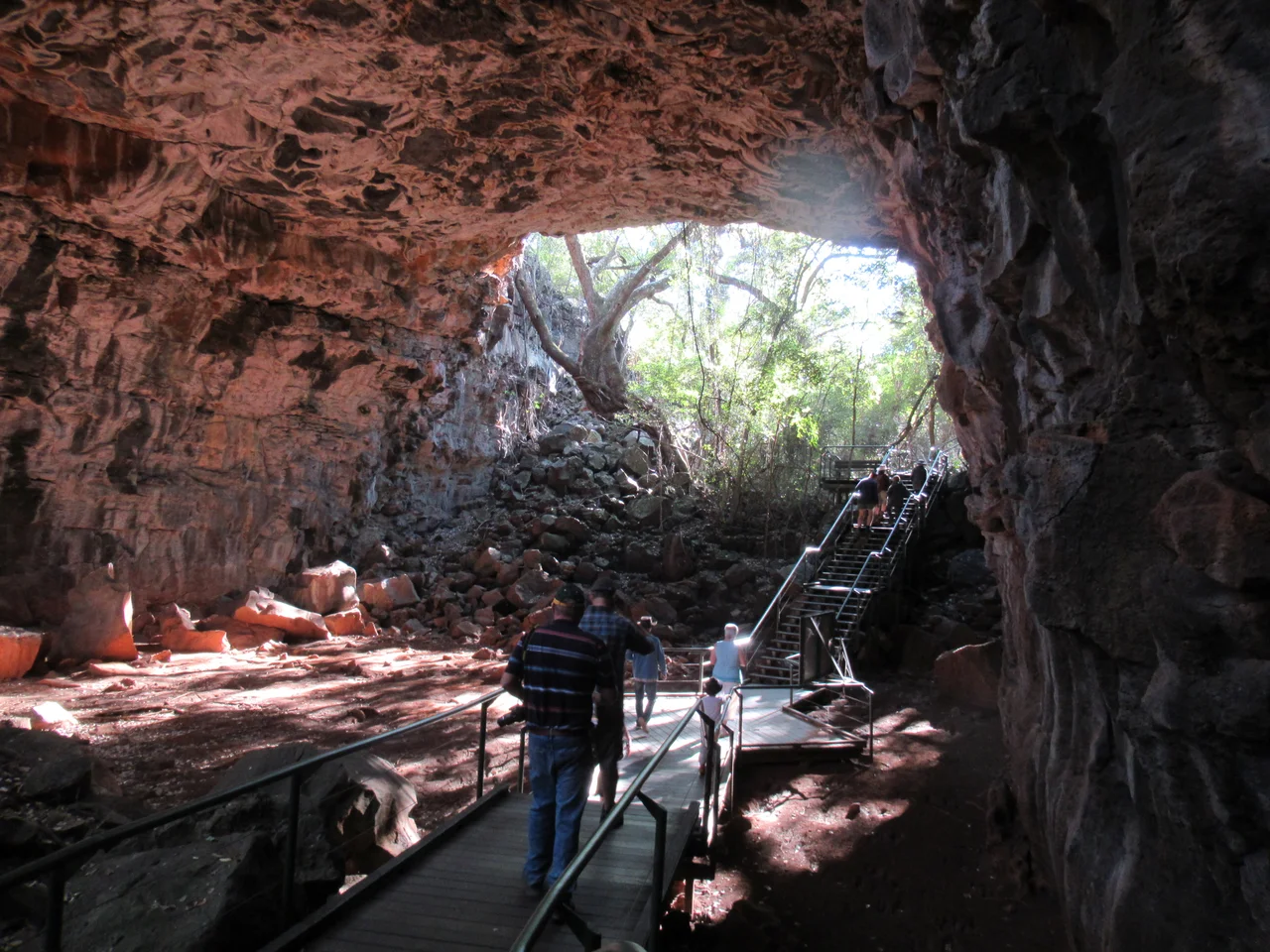 Archway cave, Undara National Park, Queensland Australia. The area is situated within the McBride volcanic province and contains 164 volcanoes, vents and cones. The lava tubes are regarded amongst the largest and longest on the planet. A lava tube is a type of lava cave formed when a low-viscosity lava flow develops a continuous and hard crust, which thickens and forms a roof above the still-flowing lava stream. The tubes at Undara are thought to have followed water courses and other natural depressions. The word Undara is aboriginal in origin and means a long way.