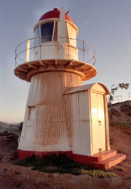 Cooktown Lifghthouse, 2005
The Cooktown Lighthouse is situated on Grassy Hill (300m above sea level). It is an automatic light now, but was once manned. The lighthouse is an historic feature of Cooktown. It was built in England, transported to Cooktown, and erected in 1885. It was automated in 1927 and was complemented by a Radar station during 1942-5.