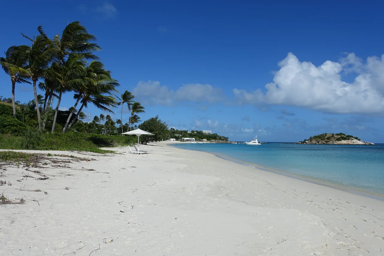 View of a beach at the resort on Lizard Island with Prince Charles Island (right)