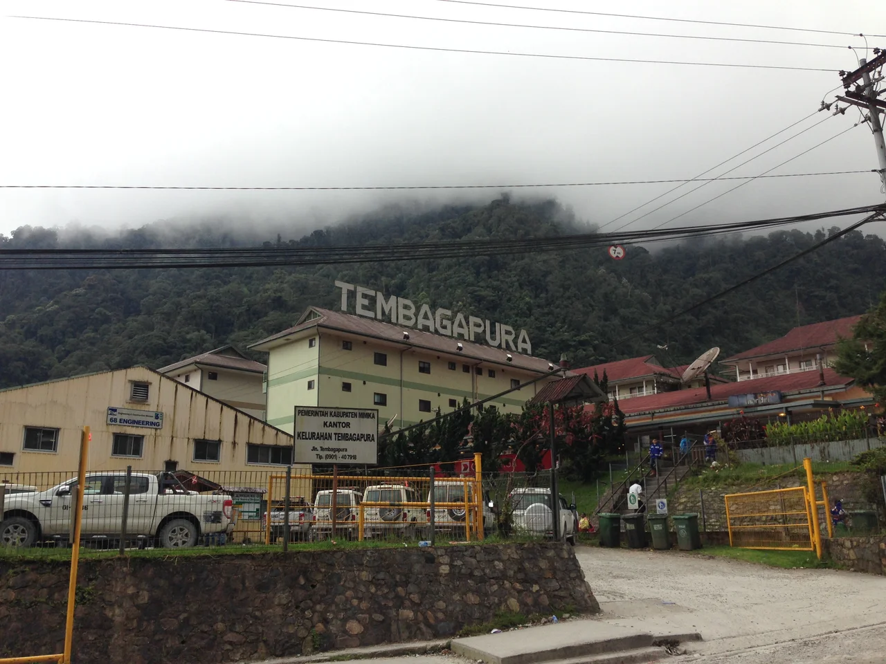 Tembagapura, Papua, Indonesia.  The company town for PT Freeport's copper/gold mine. Pictured, the building on the extreme left is a Freeport engineering office, the buildings in the middle and on the right are accommodations blocks. Taken around 1:30 pm, thick clouds are visible at the tops of the mountains, this is typical for this time of day.