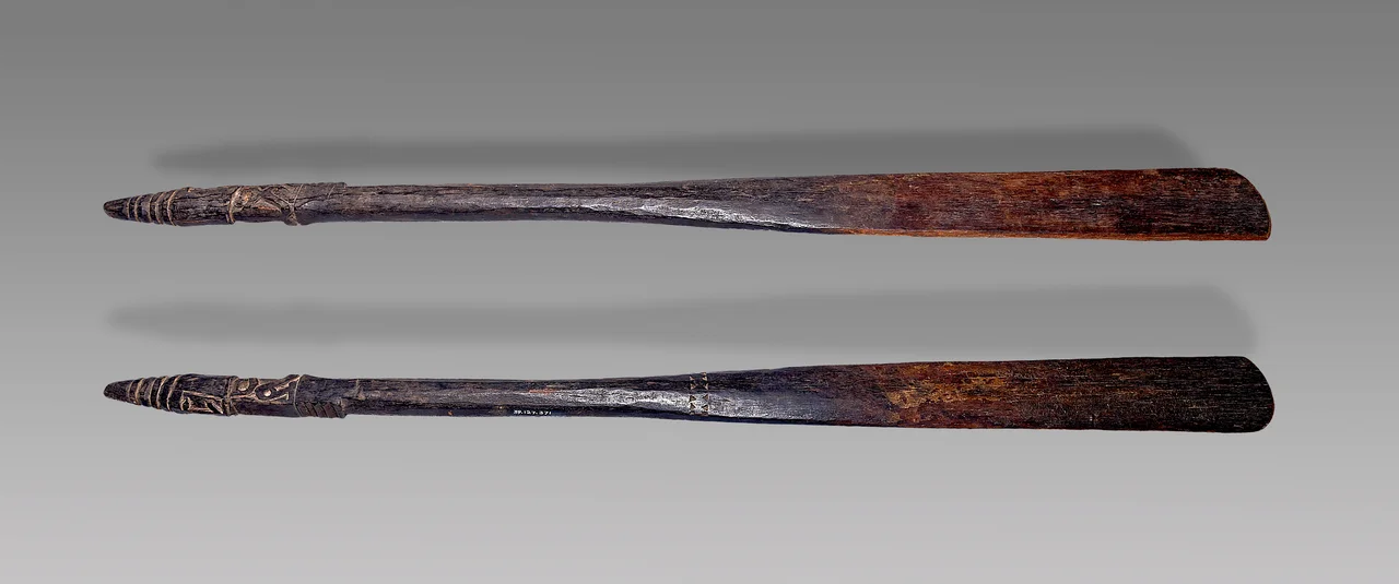 Spatula (Two views of the same object)
Population : Cenderawasih Bay (previously  Gheelvingk Bay) languages, Province of Papua, Indonesia
Collector and collection: Collection Entry in 1942 (exchange with the Musée de l'Homme in Paris)
Date of collection: the nineteenth century (4th Quarter)
 Materials: Wood
 Size : 69.5 x 5.5 x 2  cm