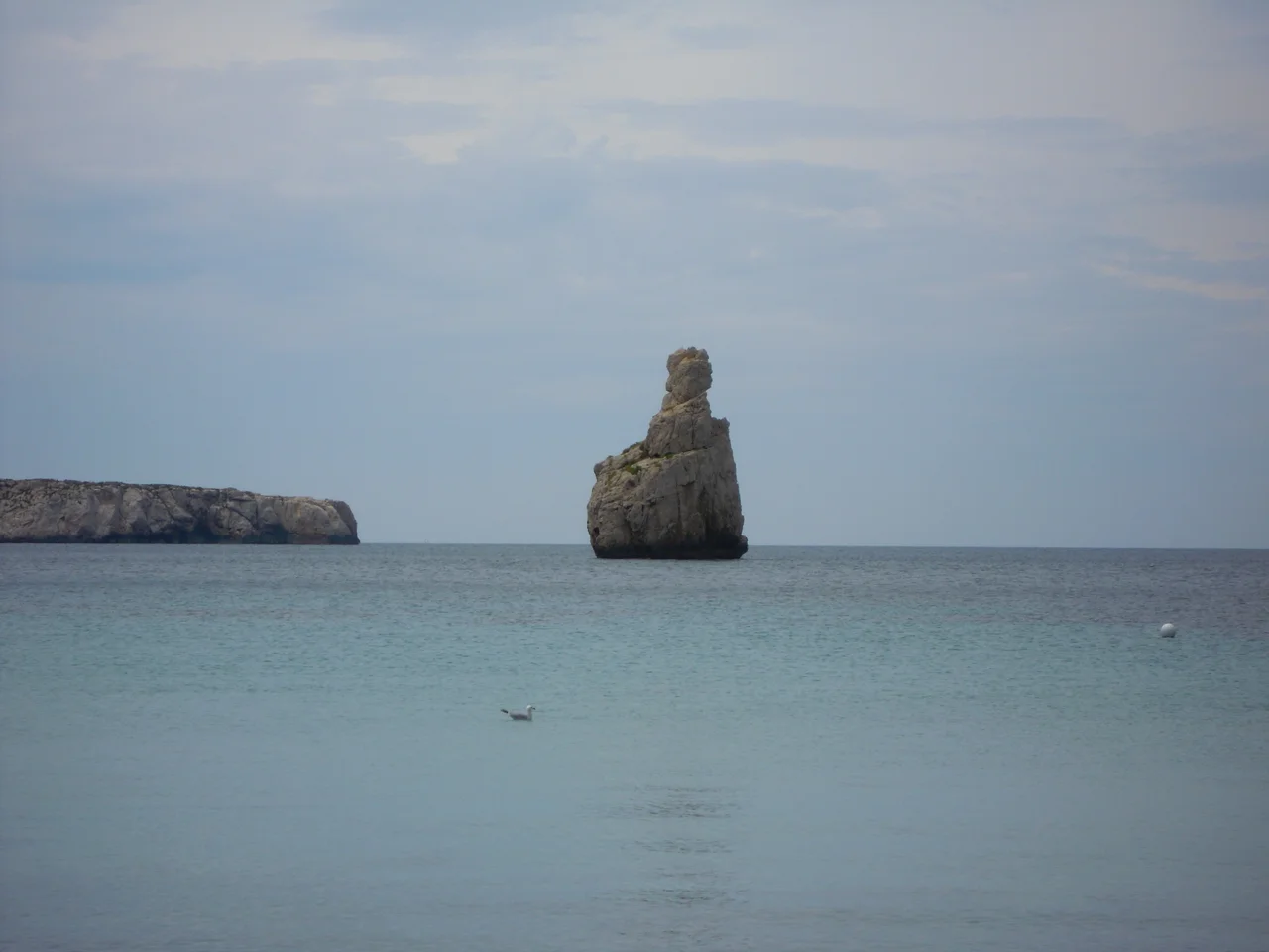 Photograph of the Iconic rock in the bay of Cala Benirrás, Ibiza, Spain